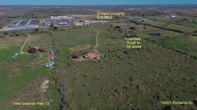 an aerial view of residential building with outdoor space and lake view