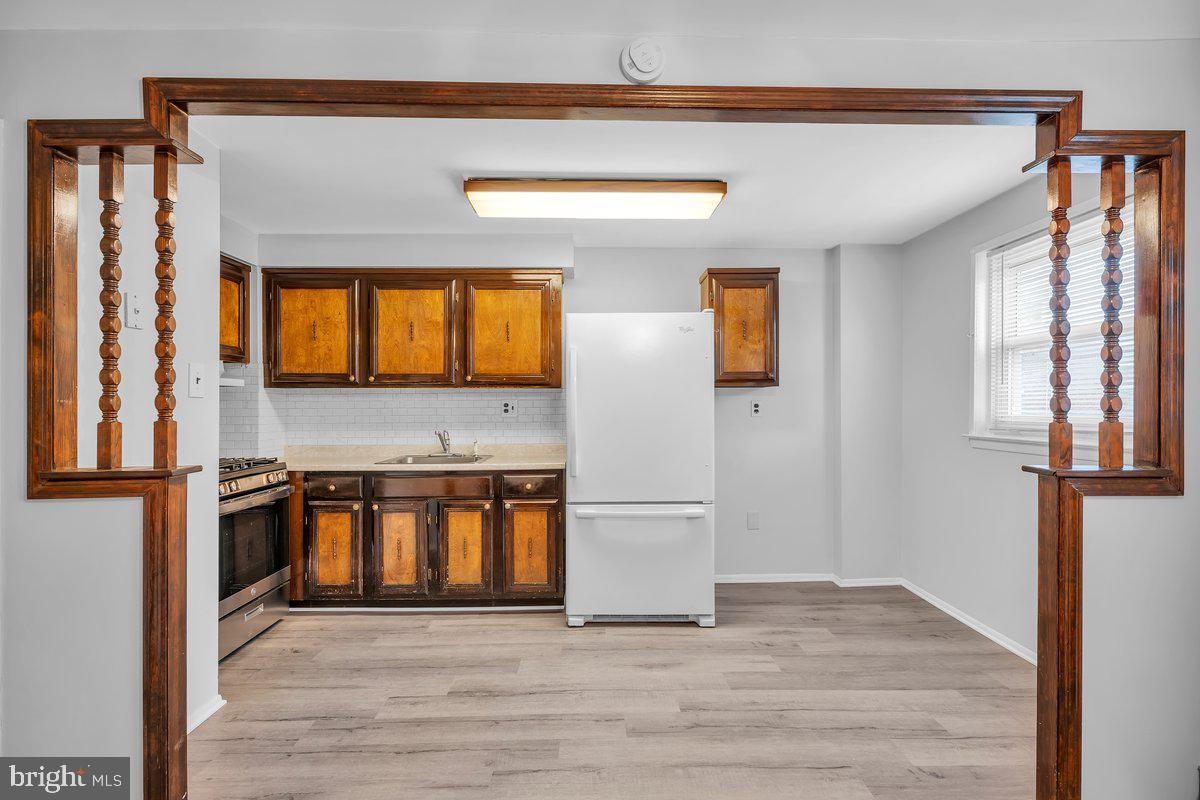 3639 Gaul Street Philadelphia, PA 19134 - Photo 11 of 23 a view of a kitchen with a sink and a refrigerator