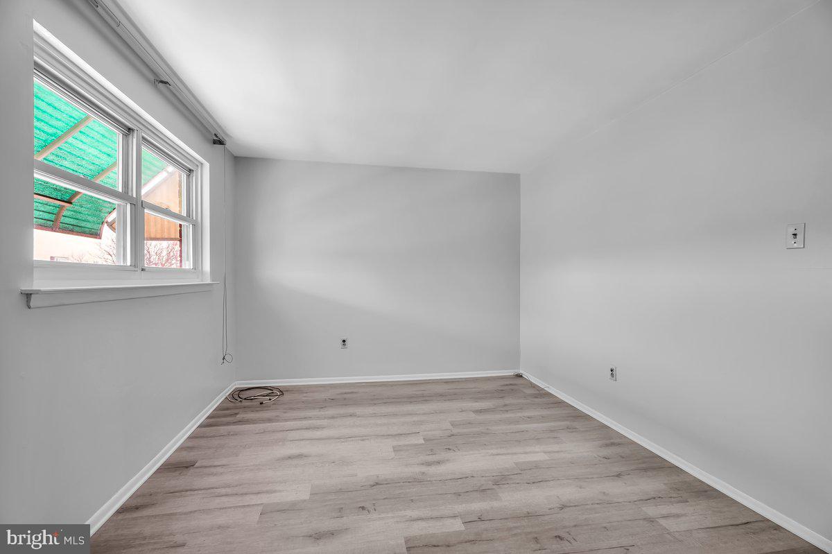 3639 Gaul Street Philadelphia, PA 19134 - Photo 13 of 23 wooden floor in an empty room with a window
