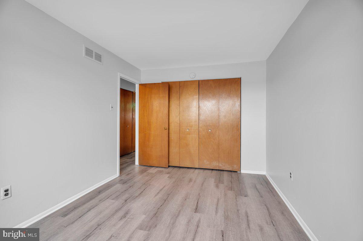 3639 Gaul Street Philadelphia, PA 19134 - Photo 15 of 23 a view of an empty room with wooden floor and closet