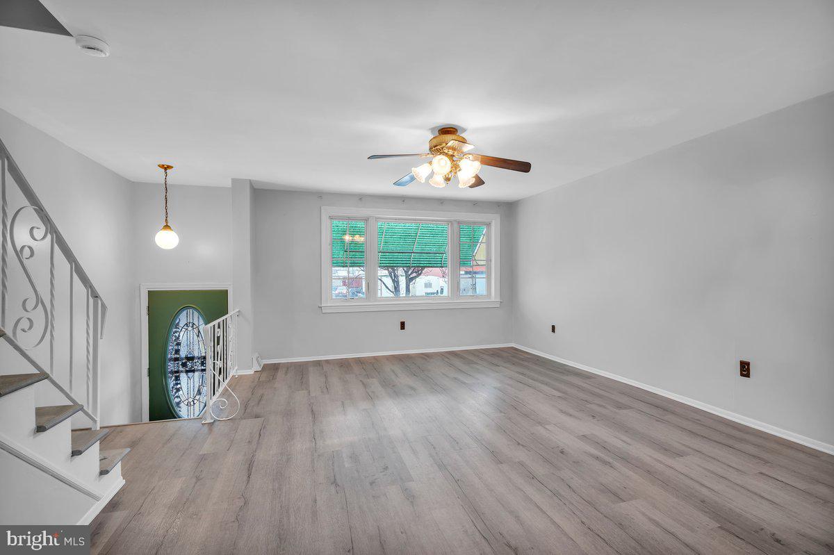 3639 Gaul Street Philadelphia, PA 19134 - Photo 3 of 23 wooden floor in an empty room with a window