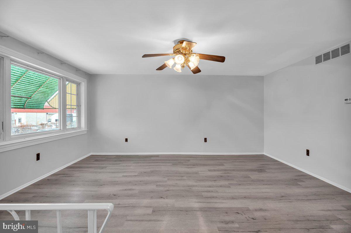 3639 Gaul Street Philadelphia, PA 19134 - Photo 4 of 23 a view of a room with wooden floor and window