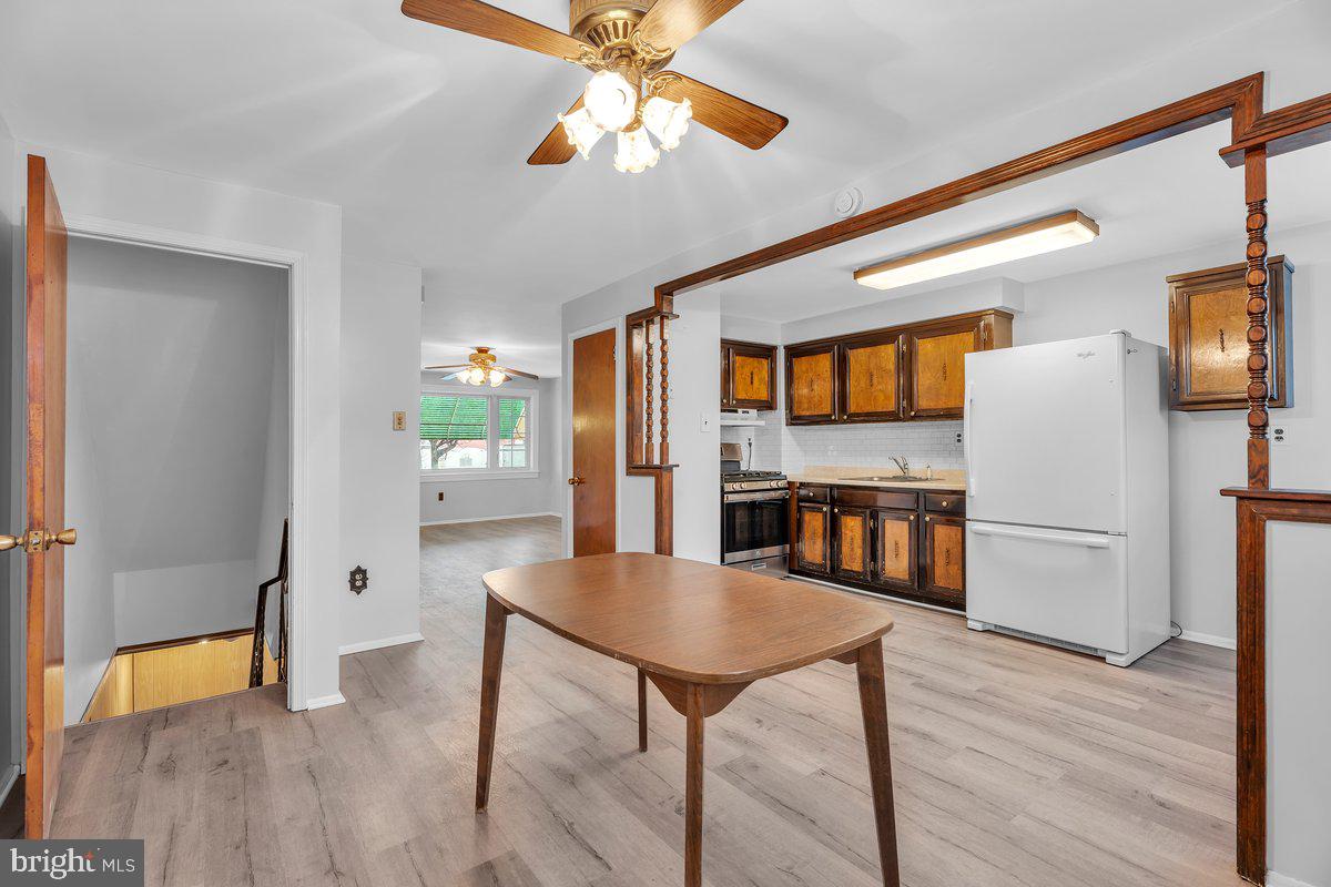3639 Gaul Street Philadelphia, PA 19134 - Photo 8 of 23 a living room with stainless steel appliances kitchen island granite countertop furniture and a wooden floor