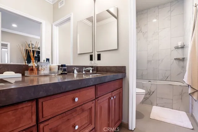 an aerial view of multiple houses with a yard