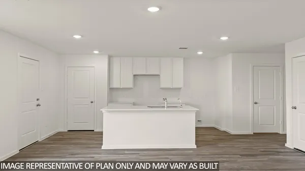 a view of a kitchen with wooden floor