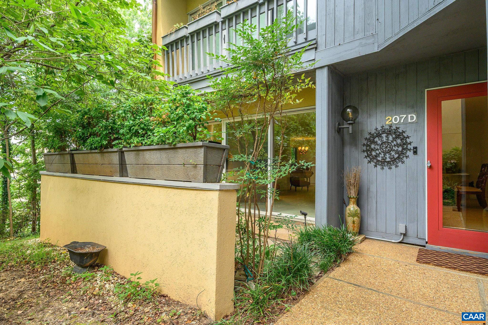 207 2nd Street Northwest, Unit D Charlottesville, VA 22902 - Photo 1 of 18 a view of a house with a tree