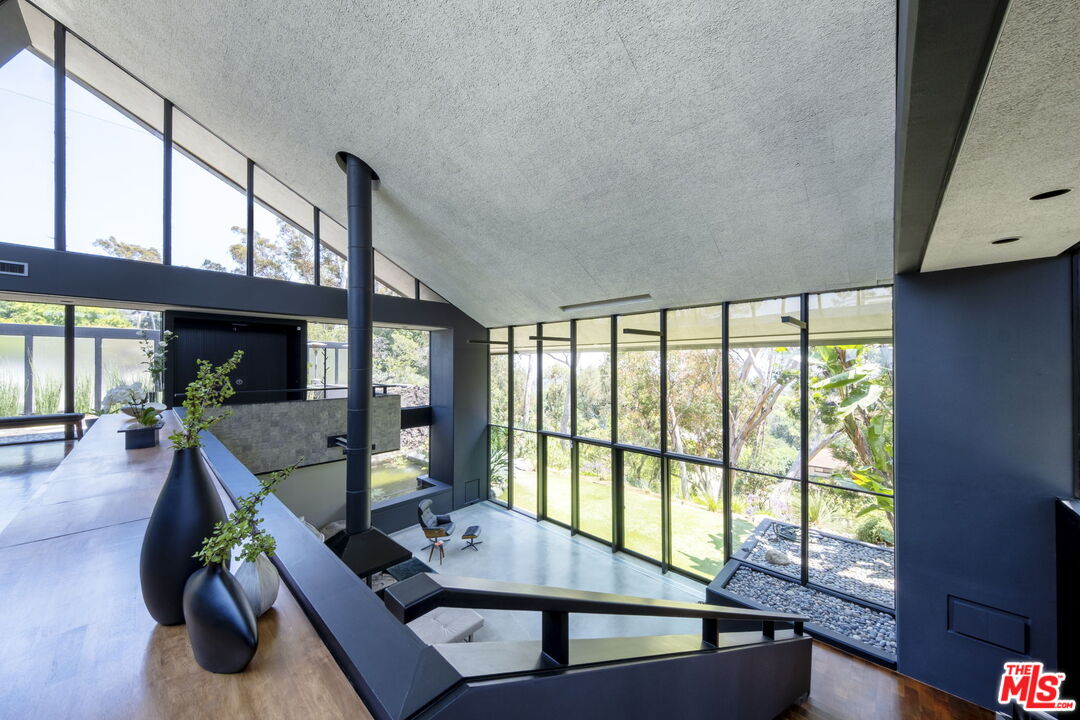 1100 Paso Alto Road Pasadena, CA 91105 - Photo 14 of 21 a living room with furniture and a flat screen tv