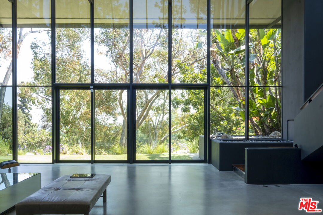 1100 Paso Alto Road Pasadena, CA 91105 - Photo 15 of 21 a living room with furniture and a large window