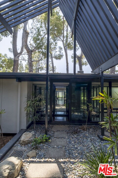 1100 Paso Alto Road Pasadena, CA 91105 - Photo 17 of 21 a front view of house with a garden