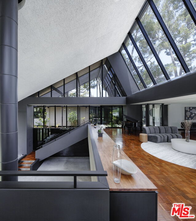 1100 Paso Alto Road Pasadena, CA 91105 - Photo 2 of 21 a view of a living room and kitchen with furniture