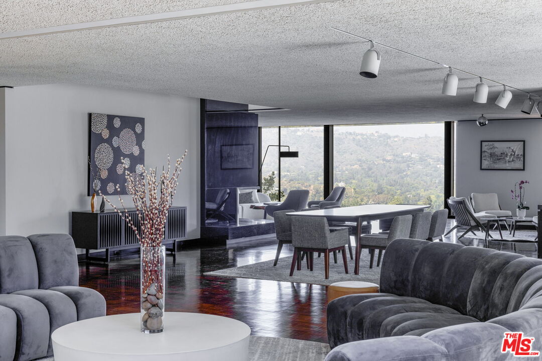 1100 Paso Alto Road Pasadena, CA 91105 - Photo 4 of 21 a living room with furniture wooden floor and a large window