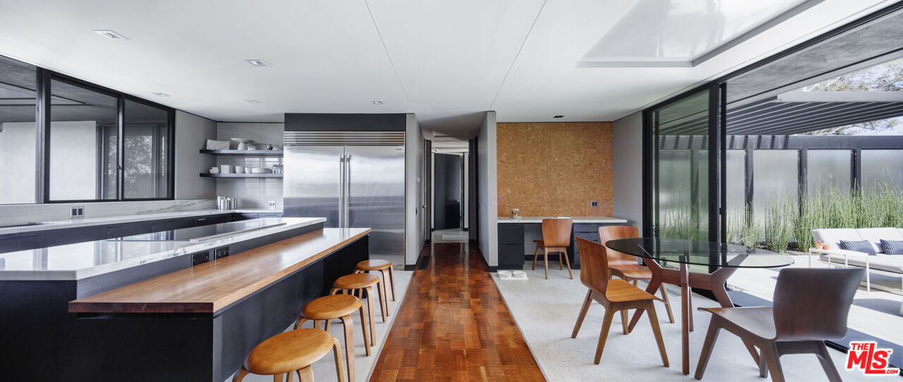 1100 Paso Alto Road Pasadena, CA 91105 - Photo 8 of 21 a kitchen with stainless steel appliances granite countertop a stove refrigerator and chairs