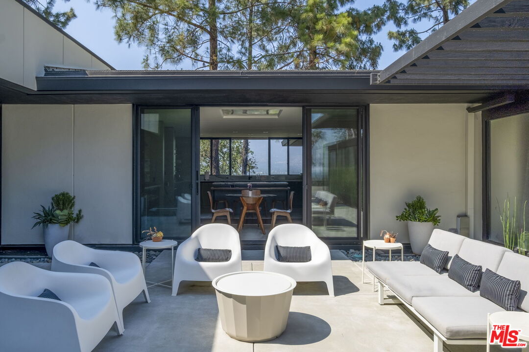 1100 Paso Alto Road Pasadena, CA 91105 - Photo 10 of 21 a dining room with furniture and wooden floor