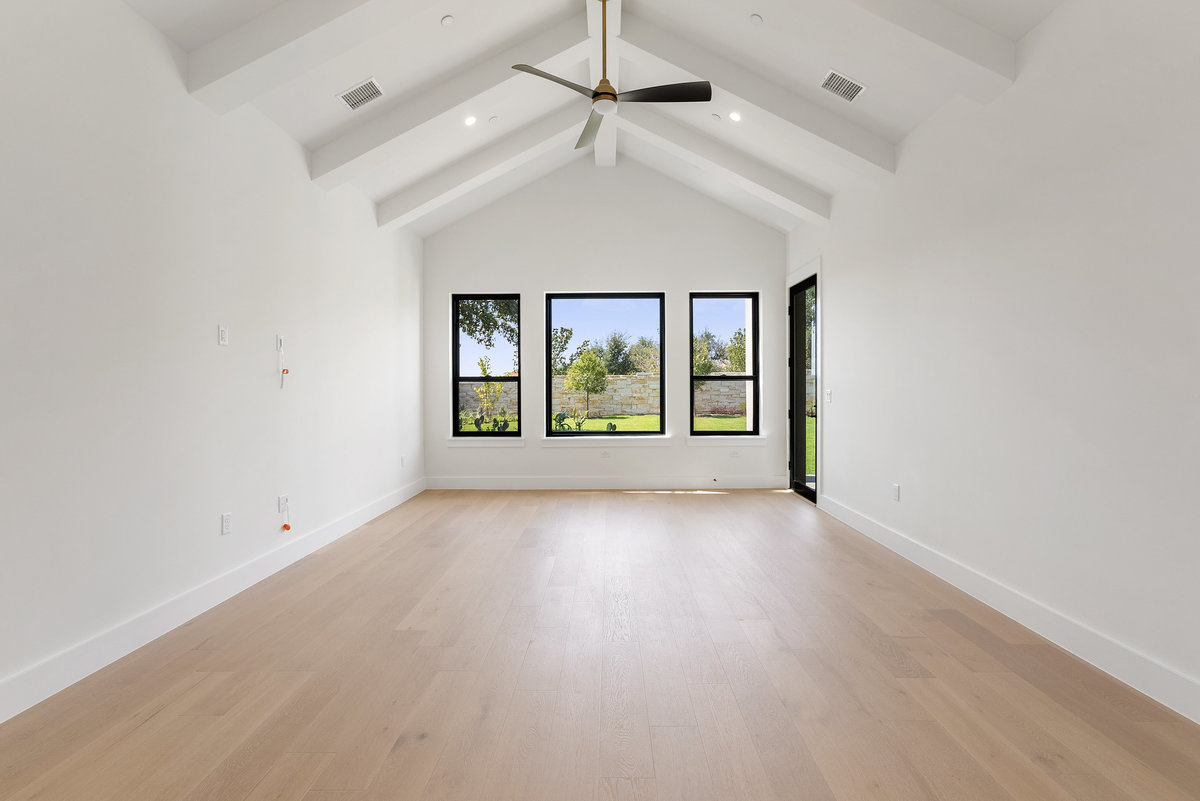6010 Adhara Pass Austin, TX 78730 - Photo 12 of 38 an empty room with windows and ceiling fan