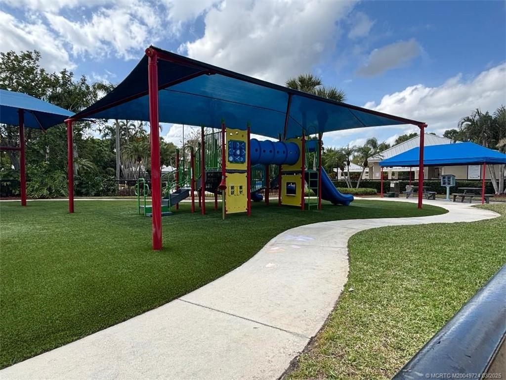 1559 Southwest Waterfall Boulevard Palm City, FL 34990 - Photo 11 of 19 Playground next to community pool