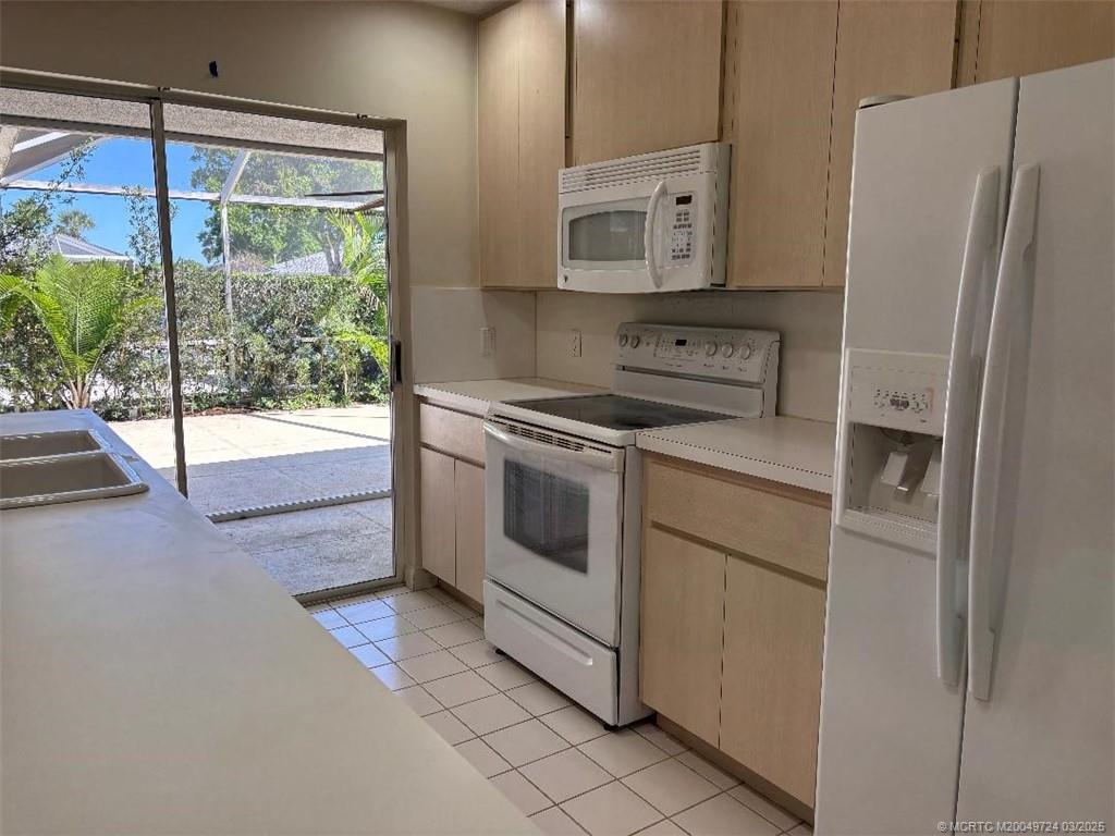 1559 Southwest Waterfall Boulevard Palm City, FL 34990 - Photo 15 of 19 Kitchen with lots of natural light