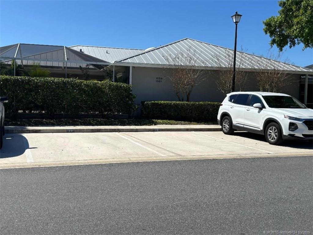 1559 Southwest Waterfall Boulevard Palm City, FL 34990 - Photo 18 of 19 Reserved parking, slots 27 & 28