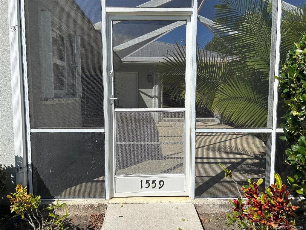 1559 Southwest Waterfall Boulevard Palm City, FL 34990 - Photo 3 of 19 Enter the lanai