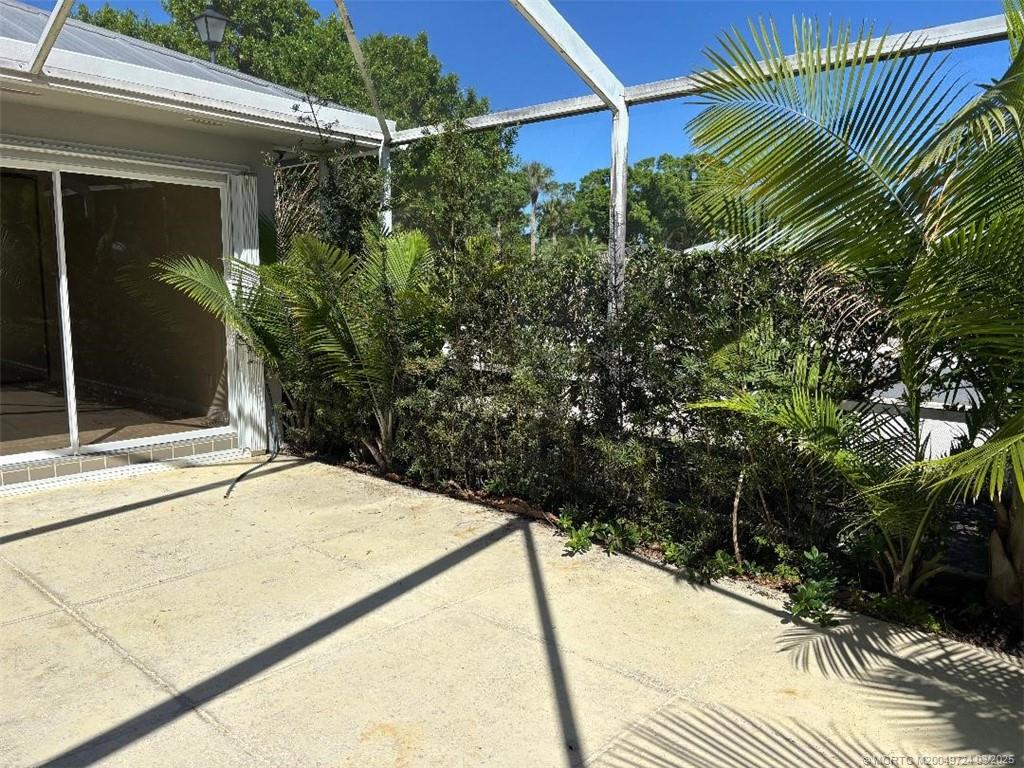 1559 Southwest Waterfall Boulevard Palm City, FL 34990 - Photo 4 of 19 Large lanai for additional living area