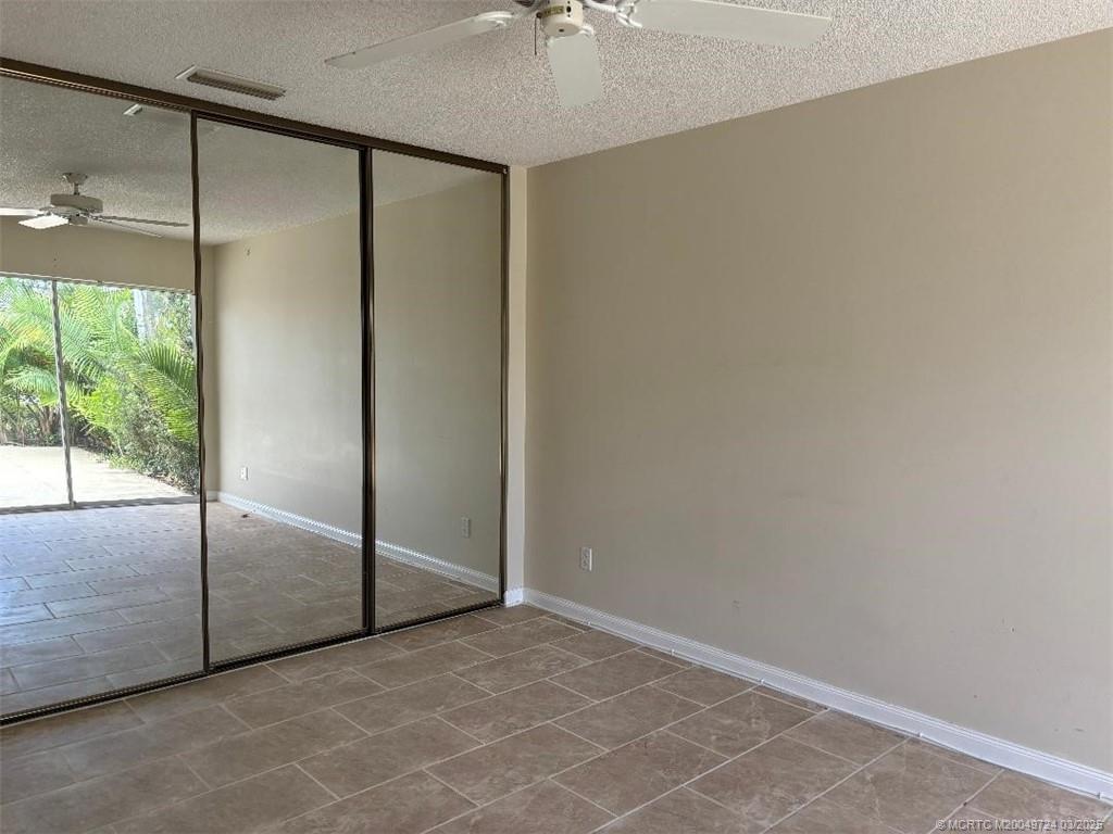 1559 Southwest Waterfall Boulevard Palm City, FL 34990 - Photo 8 of 19 Master bedroom