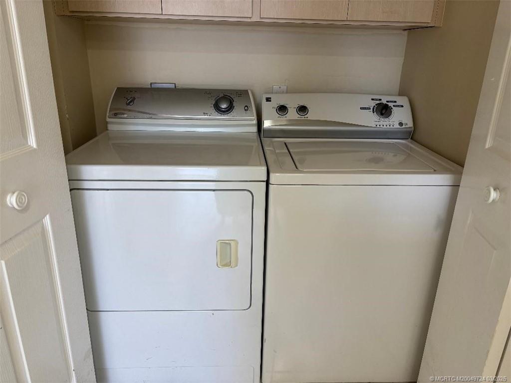 1559 Southwest Waterfall Boulevard Palm City, FL 34990 - Photo 10 of 19 Laundry closet