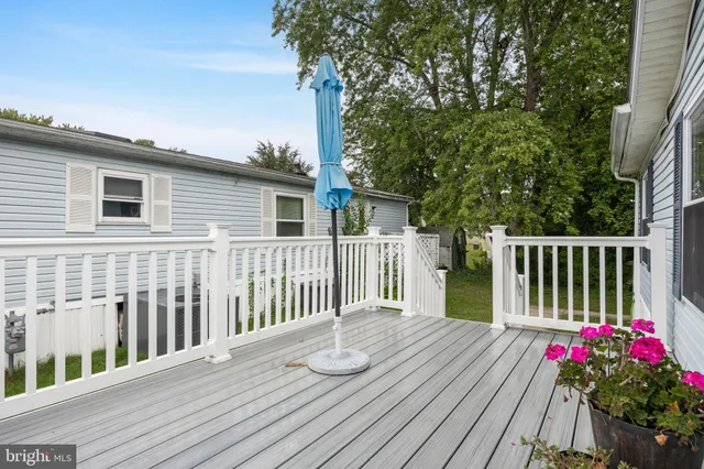 a view of a house with wooden deck