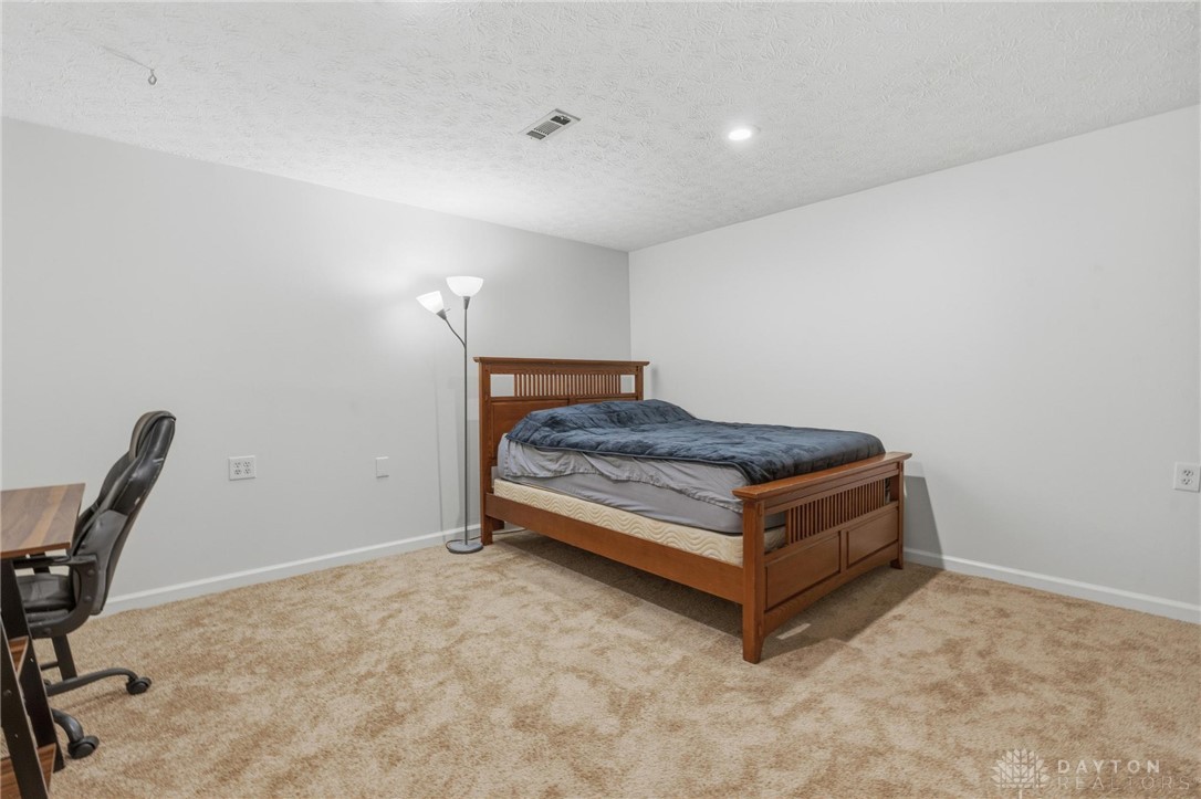 70 Martin Lane Springboro, OH 45066 - Photo 49 of 69 This spacious bonus room offers ample comfort and an inviting atmosphere.