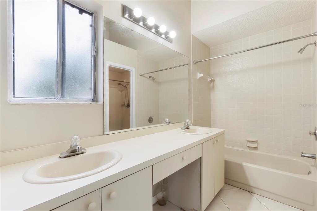 623 Red Oak Circle, Unit 121 Altamonte Springs, FL 32701 - Photo 14 of 24 a bathroom with a sink and a mirror