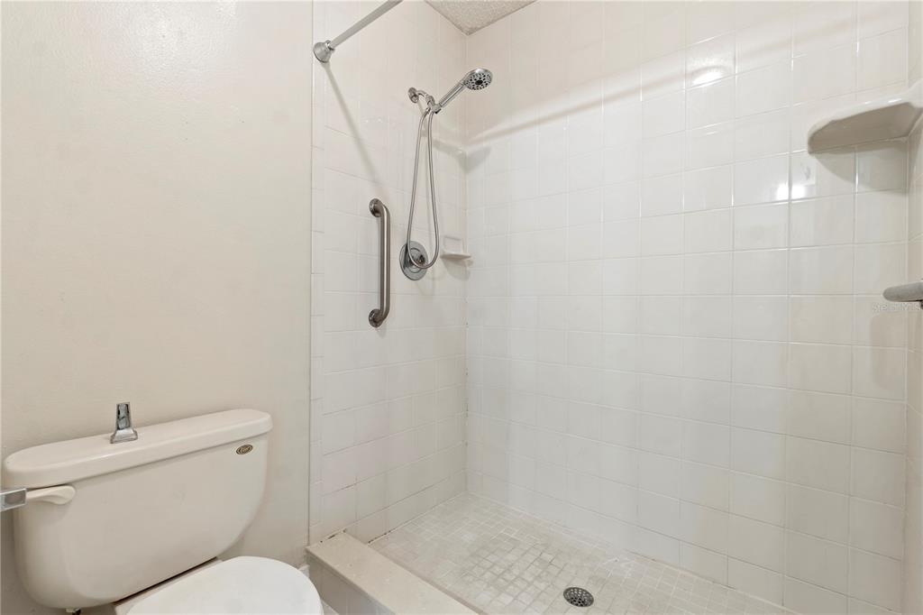 623 Red Oak Circle, Unit 121 Altamonte Springs, FL 32701 - Photo 16 of 24 a bathroom with a toilet and a shower