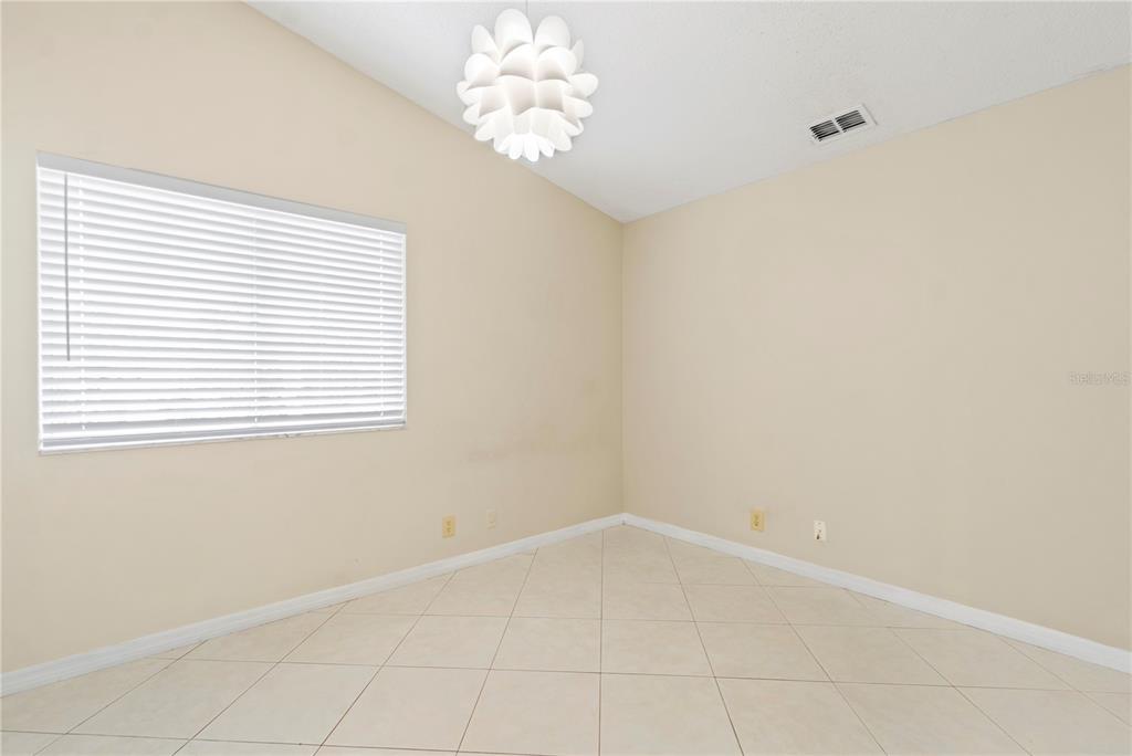 623 Red Oak Circle, Unit 121 Altamonte Springs, FL 32701 - Photo 18 of 24 wooden floor in an empty room with a window