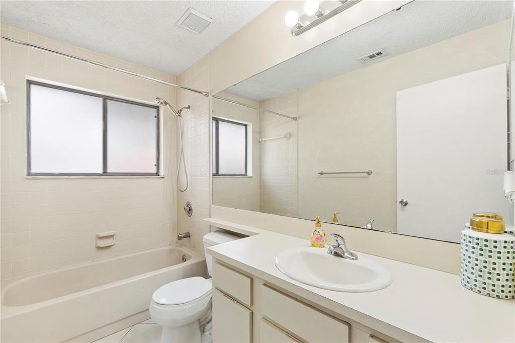 623 Red Oak Circle, Unit 121 Altamonte Springs, FL 32701 - Photo 19 of 24 a bathroom with a sink a toilet and shower