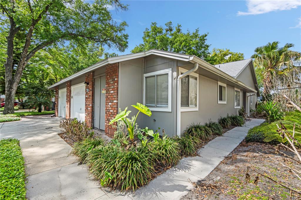 623 Red Oak Circle, Unit 121 Altamonte Springs, FL 32701 - Photo 2 of 24 a front view of a house with garden