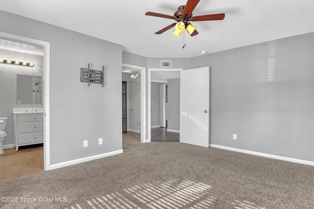 a view of a chandelier fan in a room