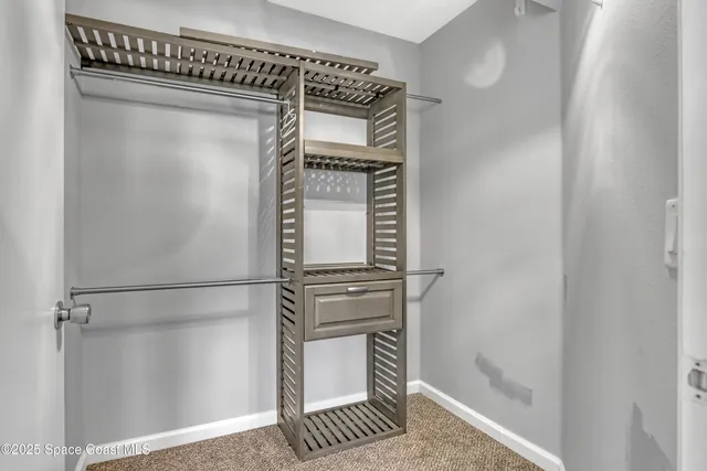 a kitchen with a refrigerator and cabinets