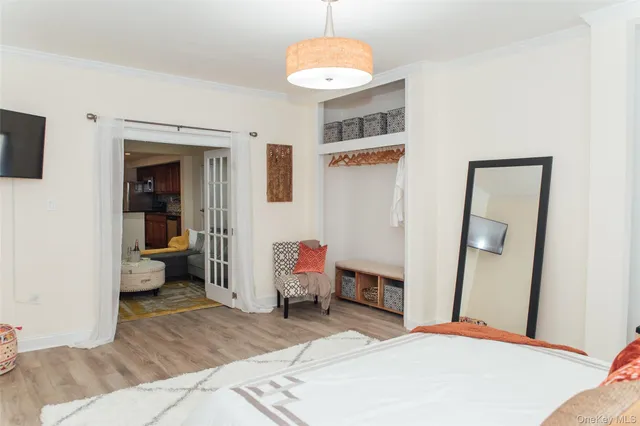 a bedroom with a bed and a couch