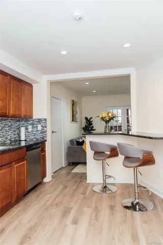 a living room with granite countertop furniture and a kitchen counter top