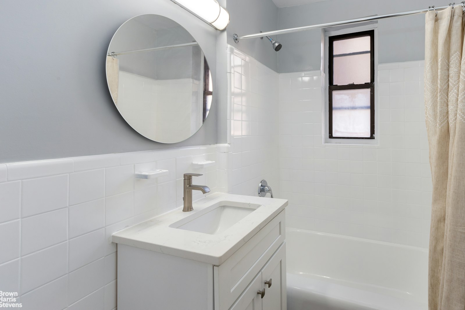 525 West 235th Street, Unit 3F Bronx, NY 10463 - Photo 13 of 15 a bathroom with a sink a bathtub and a mirror