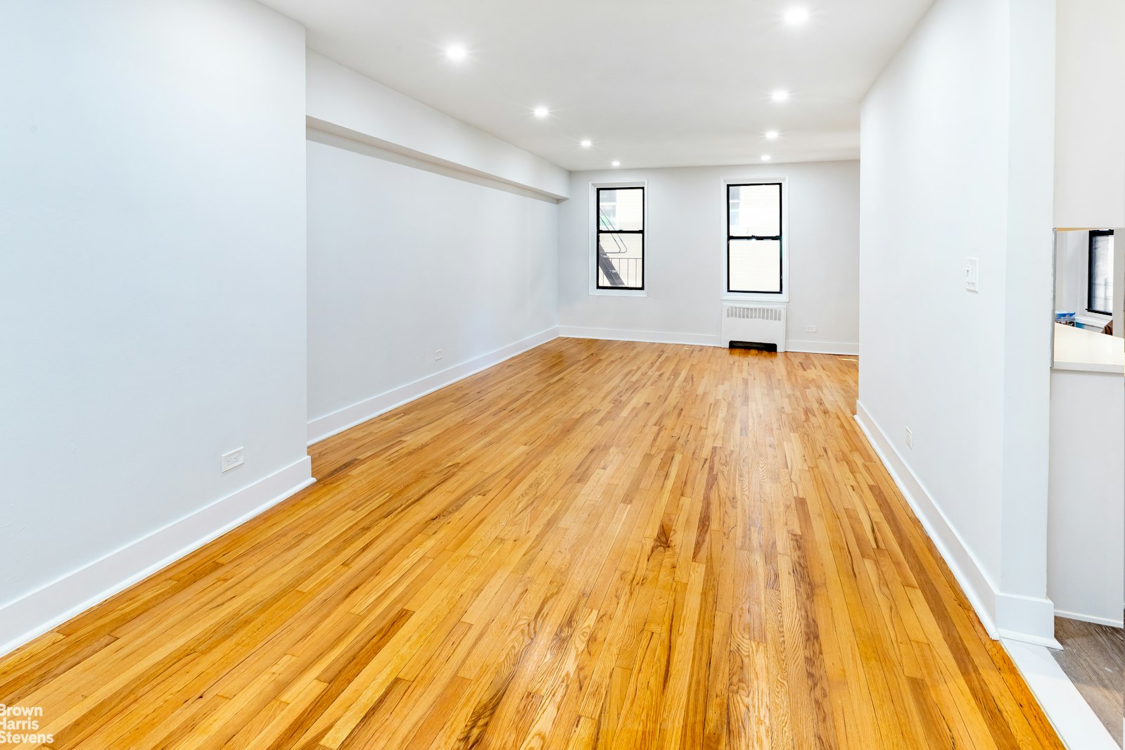 525 West 235th Street, Unit 3F Bronx, NY 10463 - Photo 3 of 15 a view of empty room with wooden floor