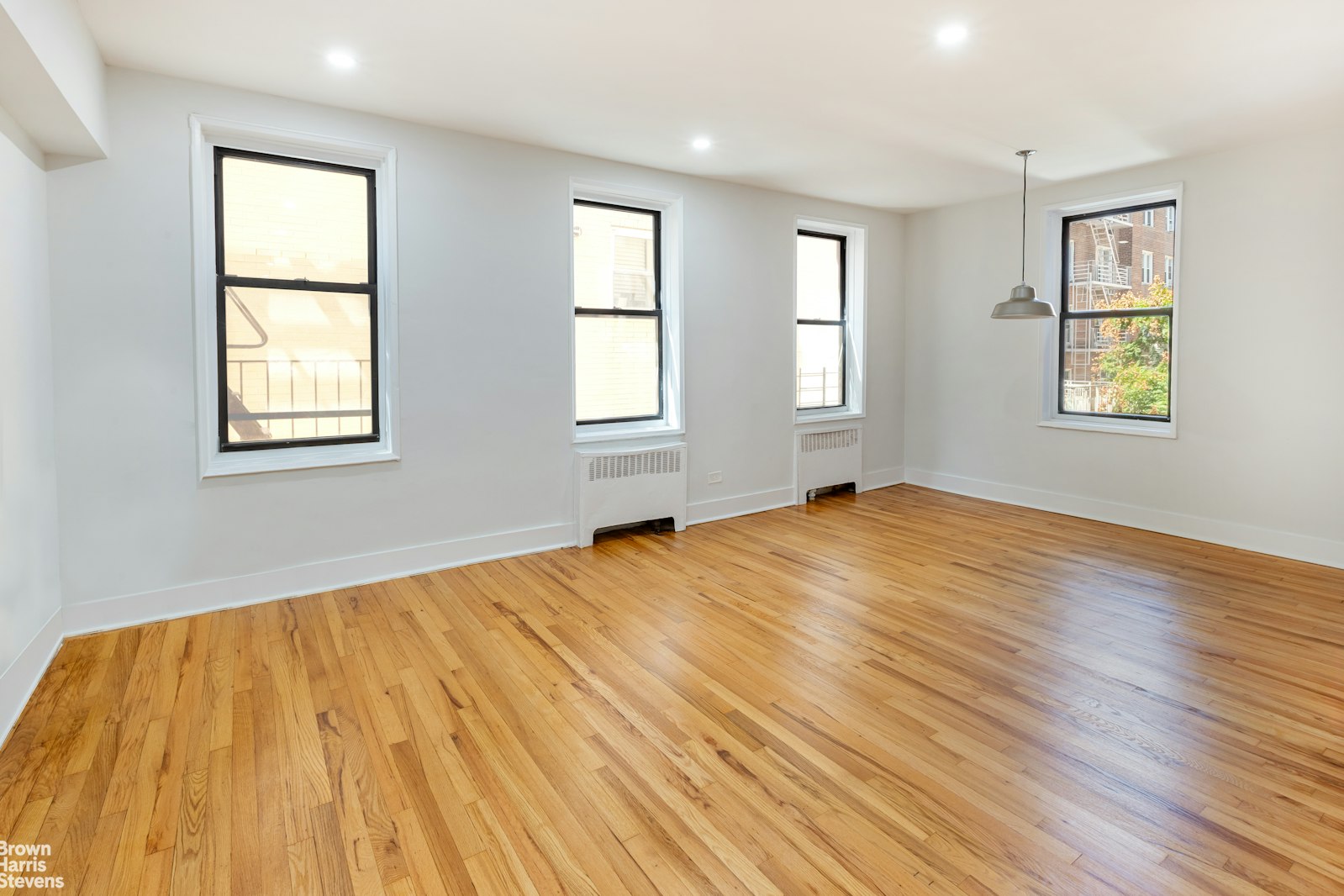 525 West 235th Street, Unit 3F Bronx, NY 10463 - Photo 6 of 15 a view of empty room with wooden floor and fan