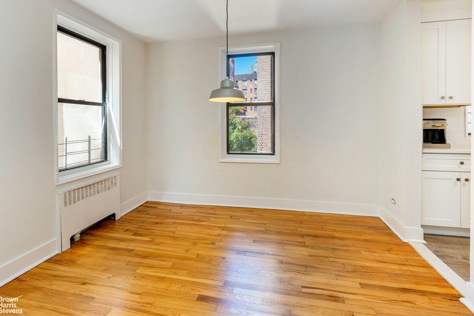 525 West 235th Street, Unit 3F Bronx, NY 10463 - Photo 7 of 15 wooden floor in an empty room with a window