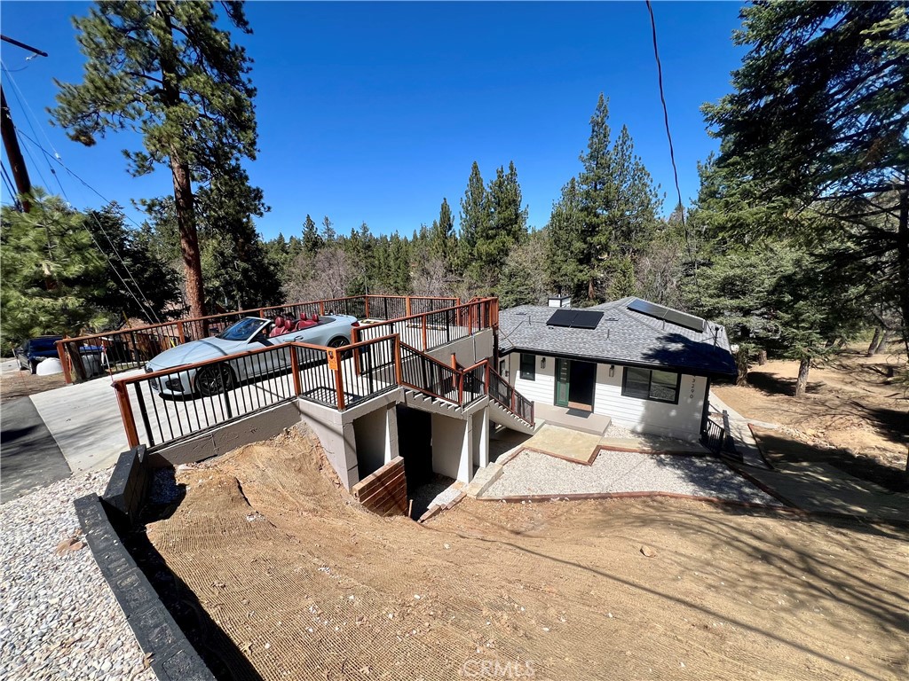 43290 Shasta Road Big Bear Lake, CA 92315 - Photo 1 of 36 a view of a roof deck with couches and wooden fence