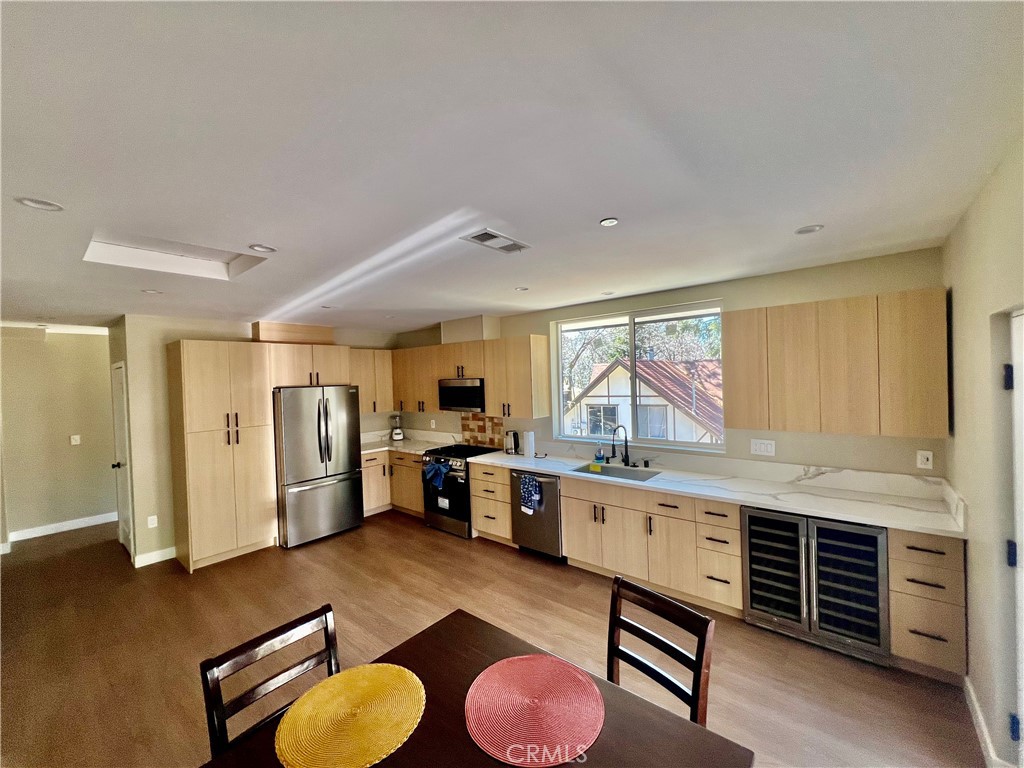 43290 Shasta Road Big Bear Lake, CA 92315 - Photo 11 of 36 a kitchen with furniture a refrigerator and a sink