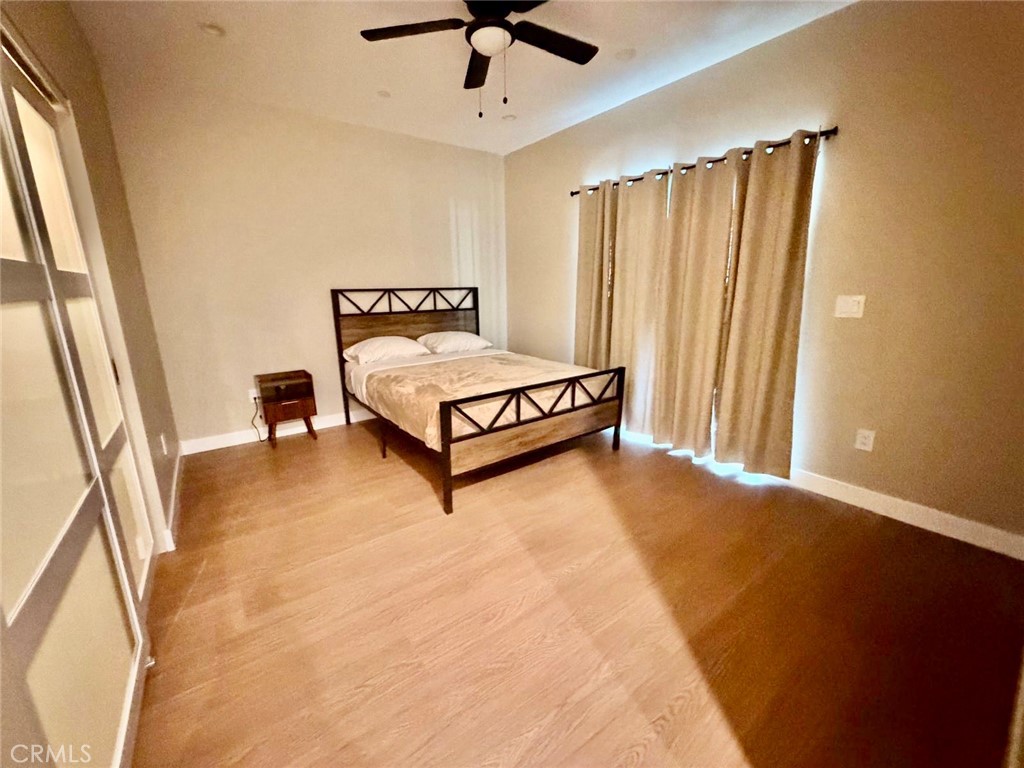 43290 Shasta Road Big Bear Lake, CA 92315 - Photo 24 of 36 a spacious bedroom with a bed and a dresser