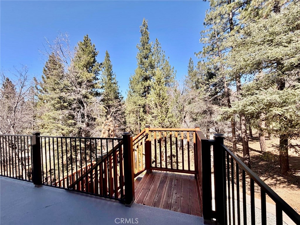 43290 Shasta Road Big Bear Lake, CA 92315 - Photo 36 of 36 a view of a balcony with wooden fence
