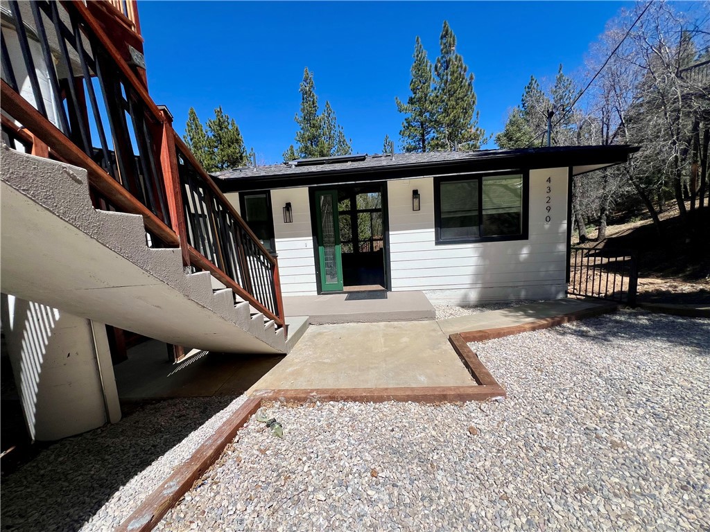 43290 Shasta Road Big Bear Lake, CA 92315 - Photo 5 of 36 a view of a house with a porch