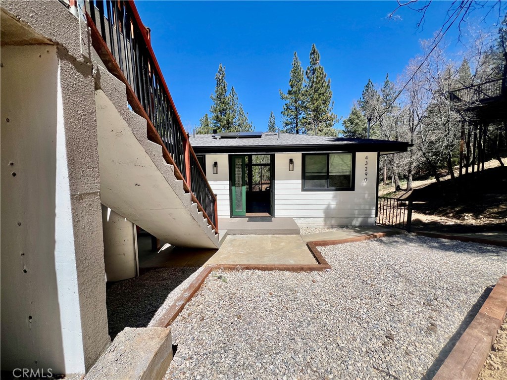 43290 Shasta Road Big Bear Lake, CA 92315 - Photo 8 of 36 a view of a house with a patio and a yard