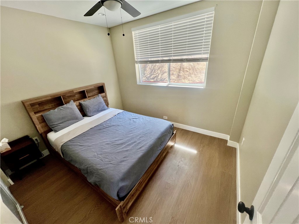43290 Shasta Road Big Bear Lake, CA 92315 - Photo 9 of 36 a bed sitting in a bedroom next to a window