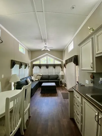 a bedroom with furniture and a wooden floor