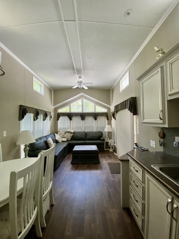 2-292 Woodhaven Sublette, IL 61367 - Photo 11 of 25 a bedroom with furniture and a wooden floor