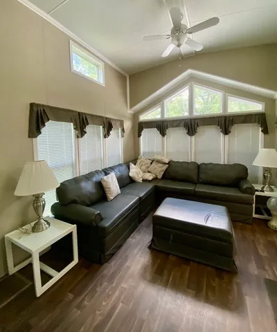 a living room with furniture and a lamp